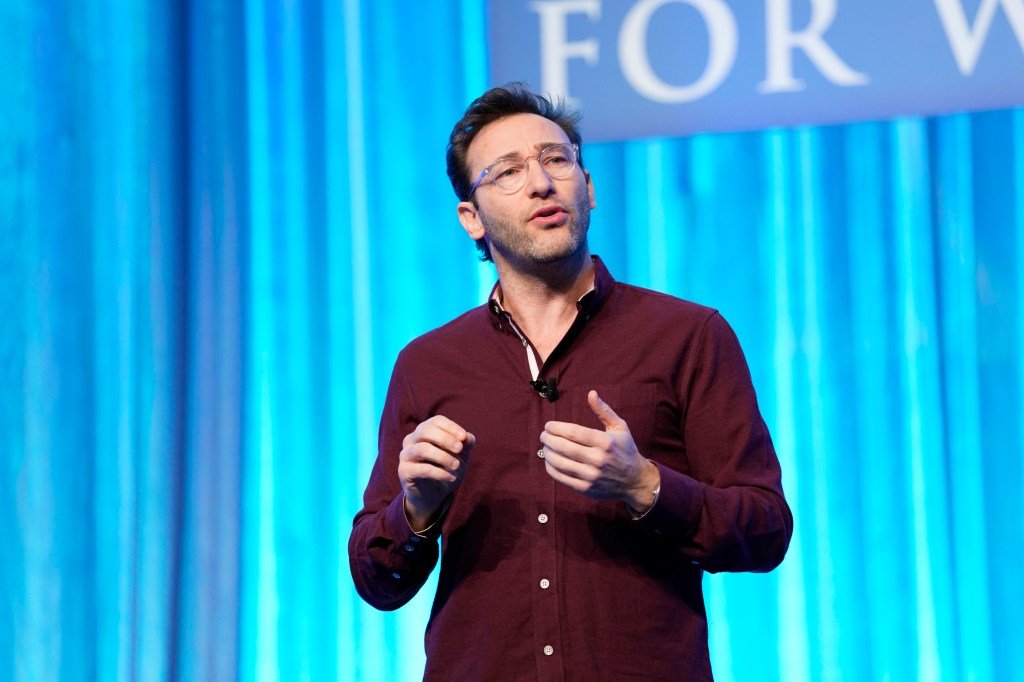 Simon Sinek speaks on stage at the women's conference for women in Massachusetts 2019.