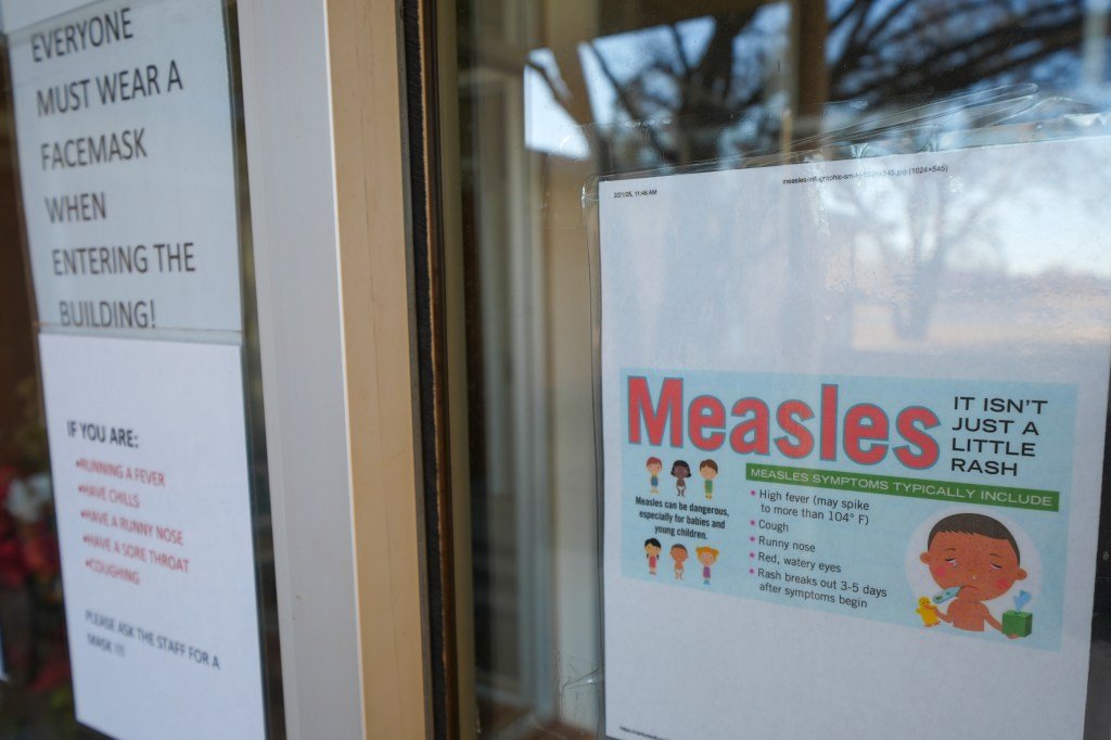 Sign outside a South Plains Public Health County Clinic in Brownfield, Texas, warning of a measles explosion