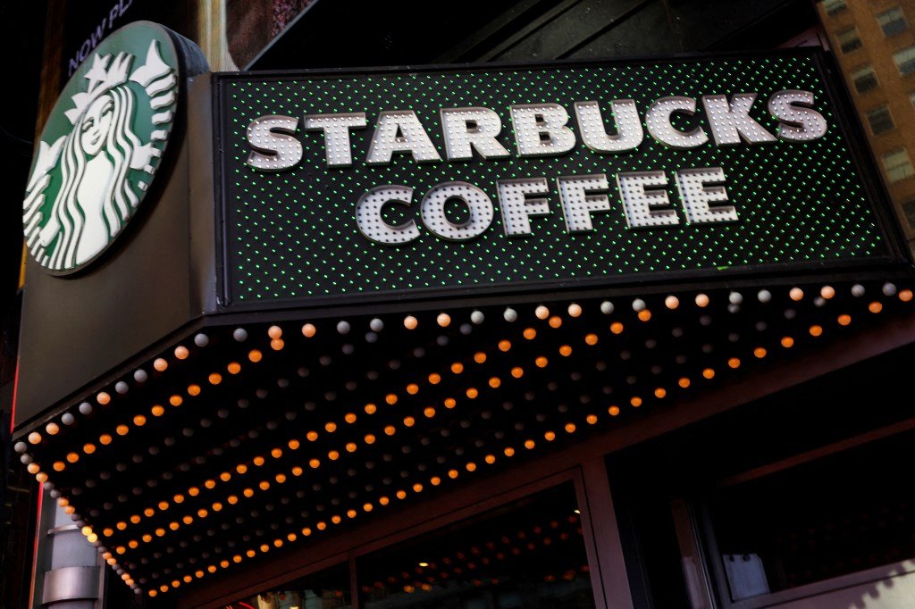 Starbucks Sign in Shop at the Times Square store in New York City